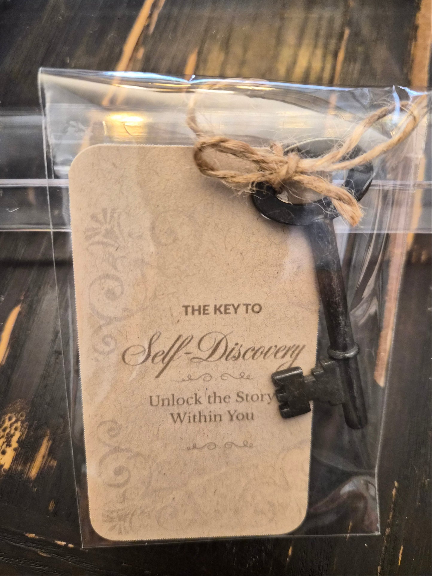 Decorative key with a tag on a dark surface